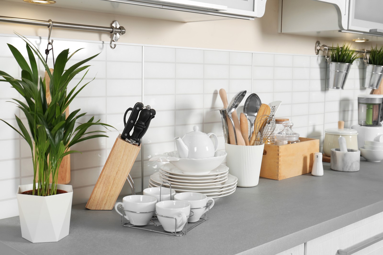 Photo of clean dishes and utensils on kitchen counter