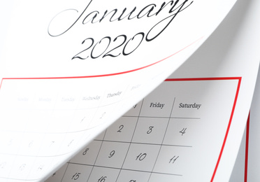 January 2020 calendar with turning pages as background, closeup