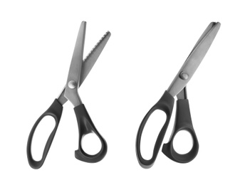 Sharp sewing scissors on white background, top view