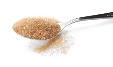 Spoon with brown sugar isolated on white