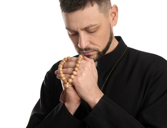 Priest with beads praying on white background