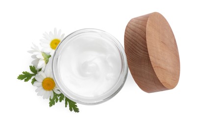 Jar of hand cream and chamomiles on white background, top view