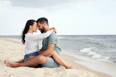 Lovely couple spending time together on beach