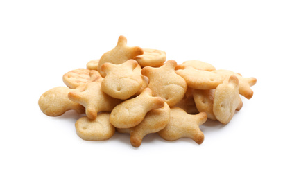 Delicious crispy goldfish crackers on white background