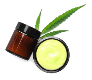 Jars with hemp cream and green leaf on white background, top view. Natural cosmetics