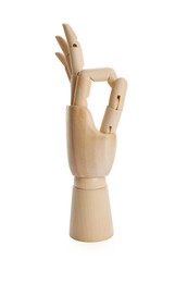 Wooden mannequin hand showing okay gesture on white background