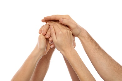 Young people holding hands together on white background, closeup. Team victory concept
