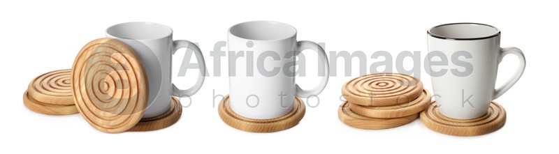 Set with stylish wooden cup coasters and mugs on white background. Banner design