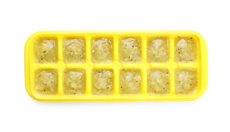 Puree in ice cube tray on white background, top view. Ready for freezing