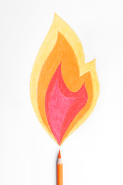 Drawing of fire and orange pencil on white background, top view