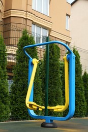 Empty outdoor playground with air walker in residential area