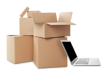 Online selling. Laptop and parcels on white background