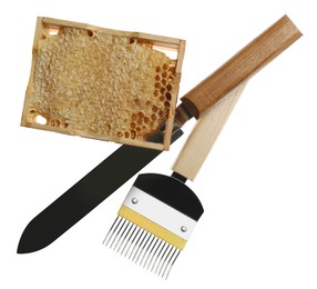 Beekeeping tools and hive frame with honeycomb on white background, top view