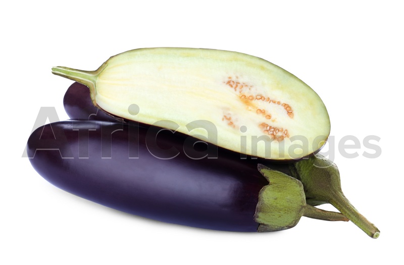 Cut and whole fresh ripe eggplants on white background