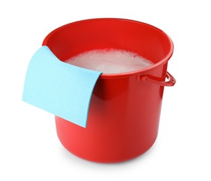 Photo of Red bucket with detergent and rag isolated on white