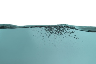 Photo of Splash of pure water on beige background, closeup