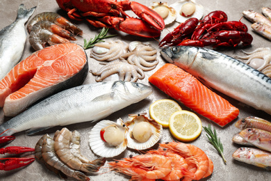 Photo of Fresh fish and seafood on marble table