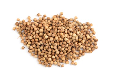 Photo of Heap of dried coriander seeds on white background, top view