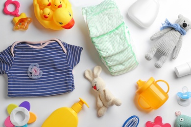 Flat lay composition with baby accessories on white background