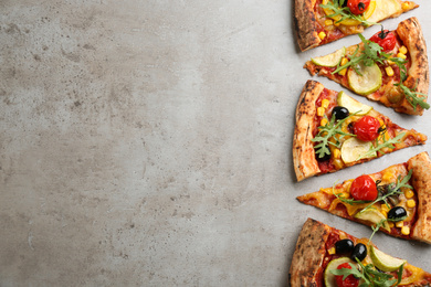 Photo of Delicious vegetable pizza on grey table, flat lay. Space for text