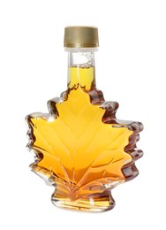 Leaf shaped bottle of tasty maple syrup isolated on white