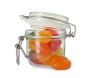 Delicious gummy candies in glass jar on white background