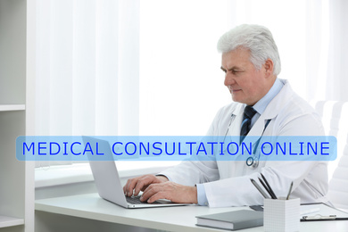 Image of Senior doctor using laptop at workplace. Medical Consultation Online 