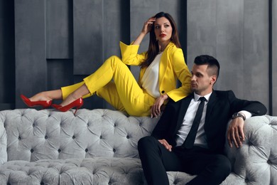 Photo of Beautiful couple in stylish living room. Luxury lifestyle
