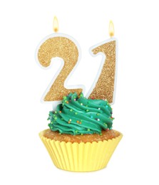 21th birthday. Delicious cupcake with number shaped candles for coming of age party on white background