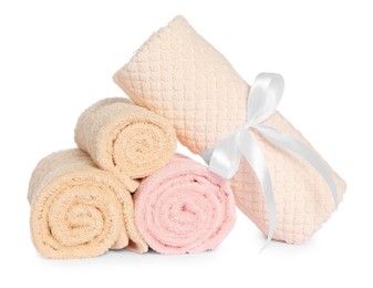 Rolled clean soft towels isolated on white