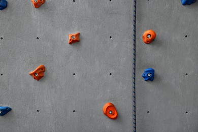 Colorful climbing wall with holds. Extreme sport