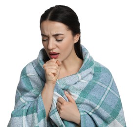 Young woman wrapped in blanket coughing on white background. Cold symptoms