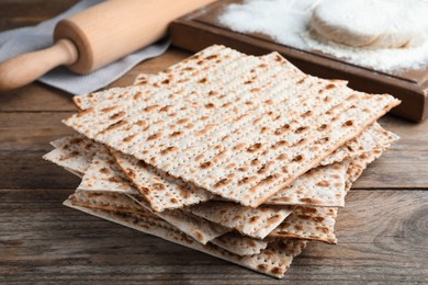 Stack of traditional matzos on wooden table