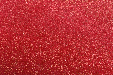 Closeup view of sparkling red glitter background