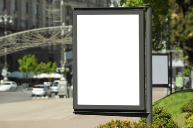 Blank advertising board on city street. Mockup for design
