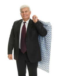 Senior man holding garment cover with clothes on white background. Dry-cleaning service