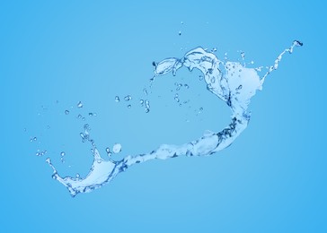 Splash of pure water on light blue background