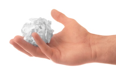 Man crumpling paper against white background, closeup. Generating idea