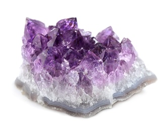 Photo of Beautiful purple amethyst gemstone on white background