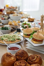 Photo of Brunch table setting with different delicious food indoors