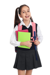 Little girl in uniform with school stationery on white background