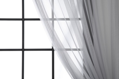 Photo of Modern window with curtain in room, closeup. Space for text