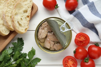 Photo of Flat lay composition with tin can of tasty cod liver and different products on white wooden table