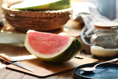 Slice of fresh juicy watermelon on wooden table