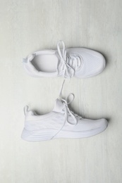 Stylish sport shoes on white background, flat lay. Trendy footwear