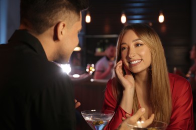 Man and woman flirting with each other in bar