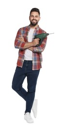 Young man with power drill on white background