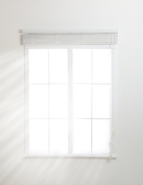 Modern window with open blinds in room