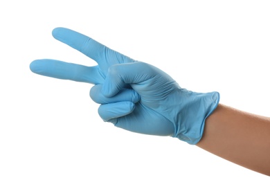 Person in blue latex gloves showing gesture against white background, closeup on hand