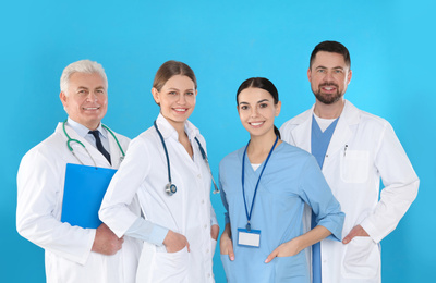 Group of doctors against blue background. Medical service